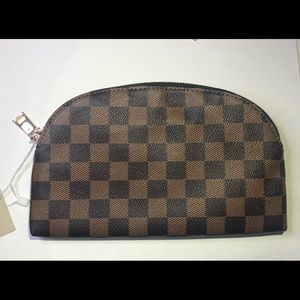 Brown checkered cosmetic/wristlet bag